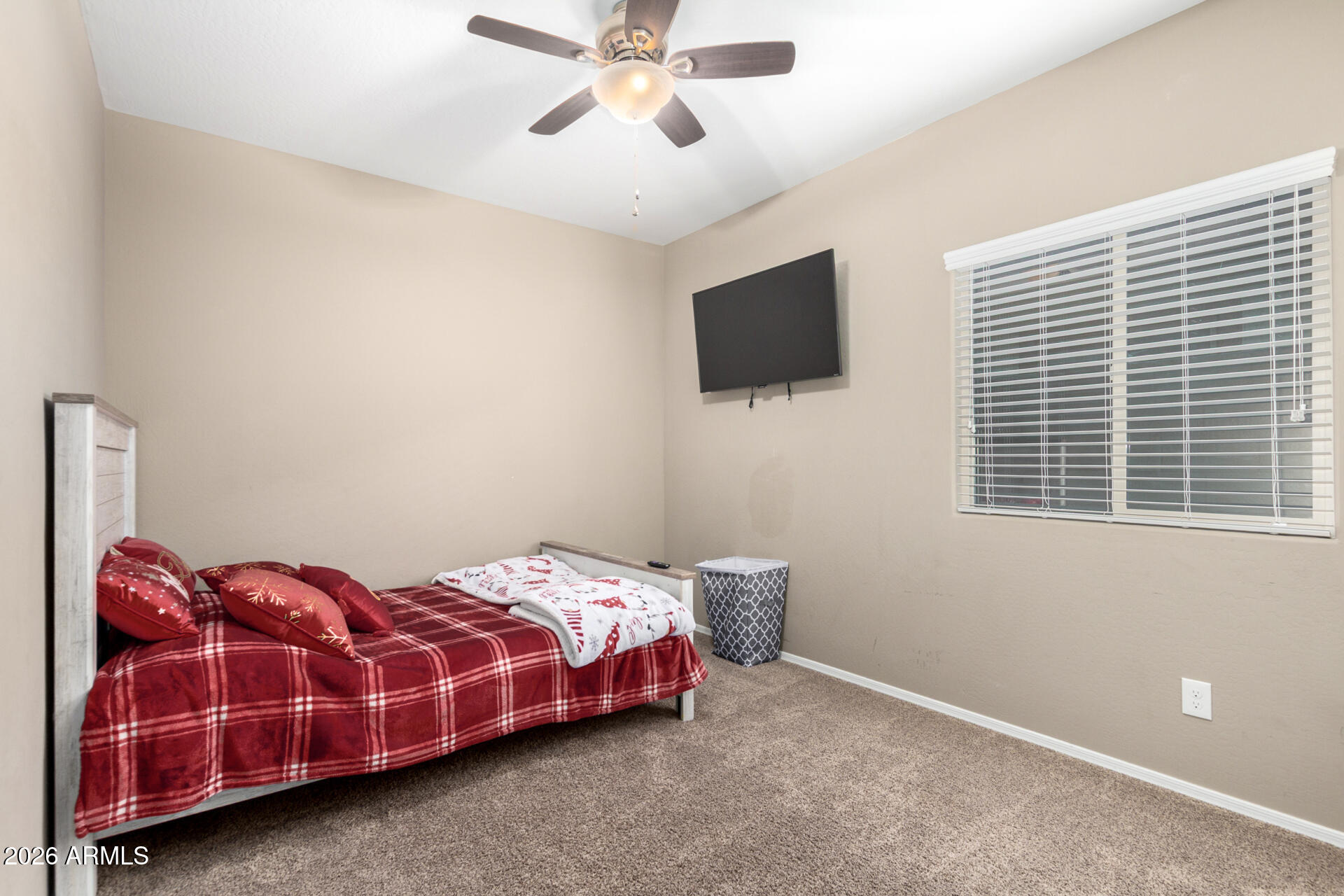10816 West Nosean Road Peoria, AZ 85383 - Photo 23 of 42 a bedroom with a bed and a flat screen tv