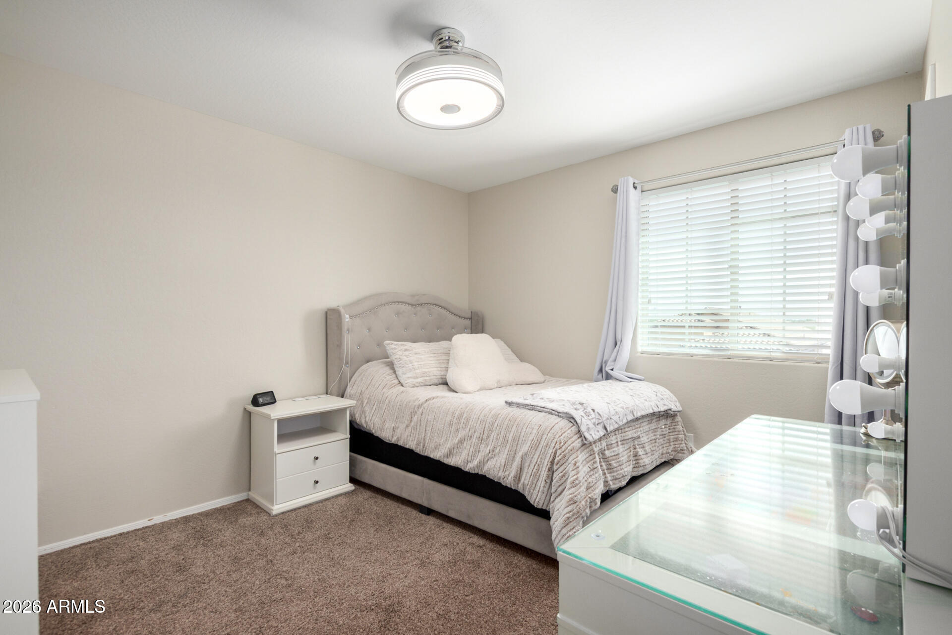 10816 West Nosean Road Peoria, AZ 85383 - Photo 26 of 42 a bedroom with bed and window