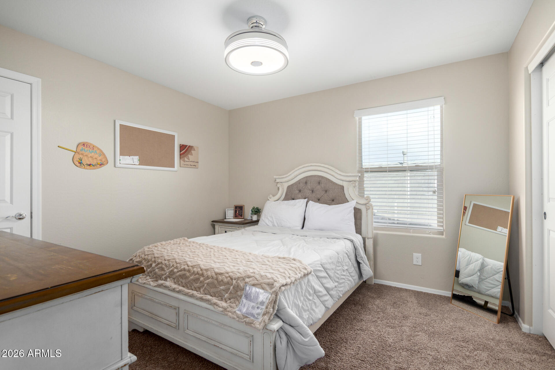 10816 West Nosean Road Peoria, AZ 85383 - Photo 29 of 42 a bedroom with a bed and a window