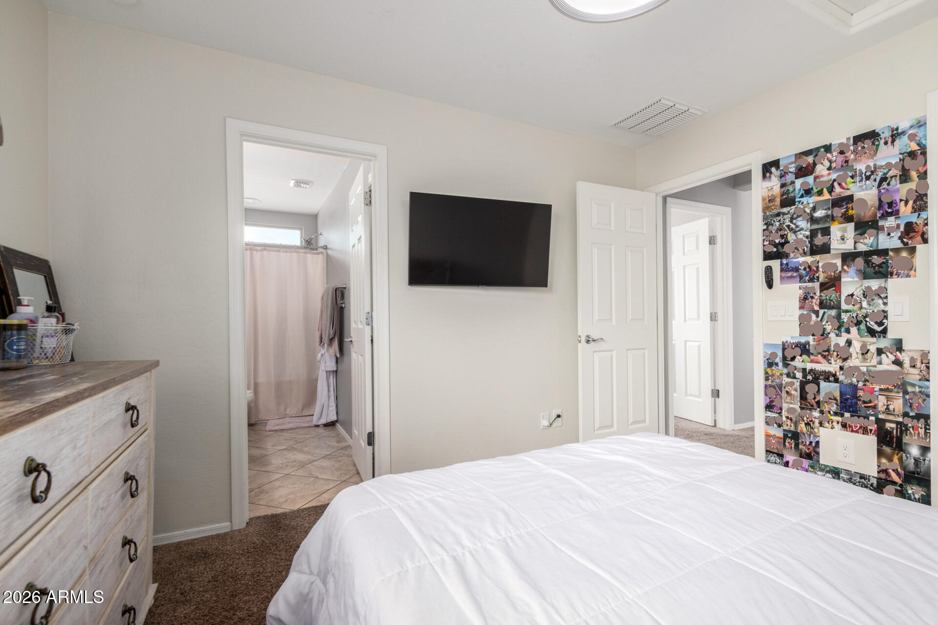 10816 West Nosean Road Peoria, AZ 85383 - Photo 32 of 42 a bedroom with a bed and a flat screen tv