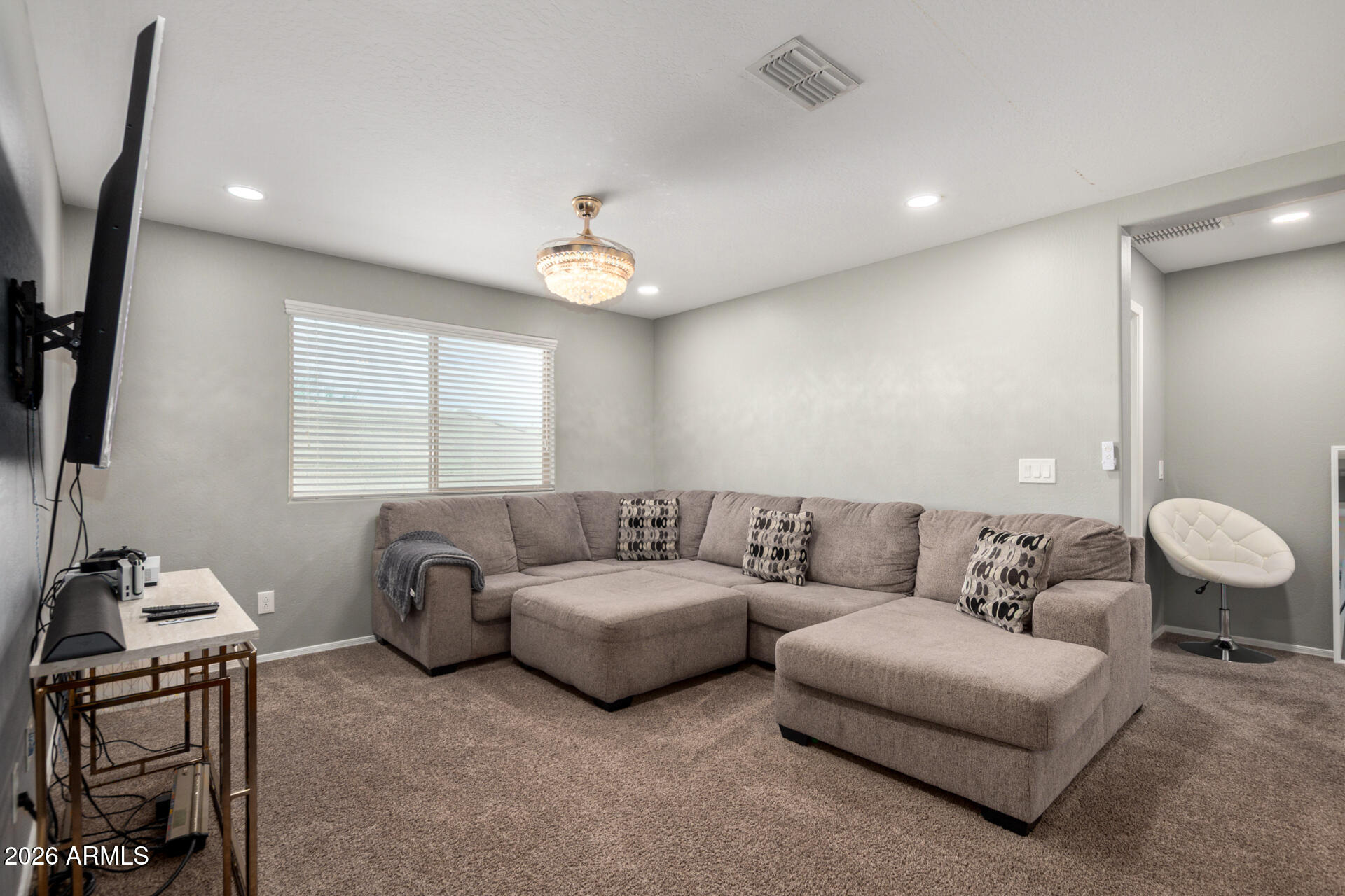 10816 West Nosean Road Peoria, AZ 85383 - Photo 36 of 42 a living room with furniture and a window