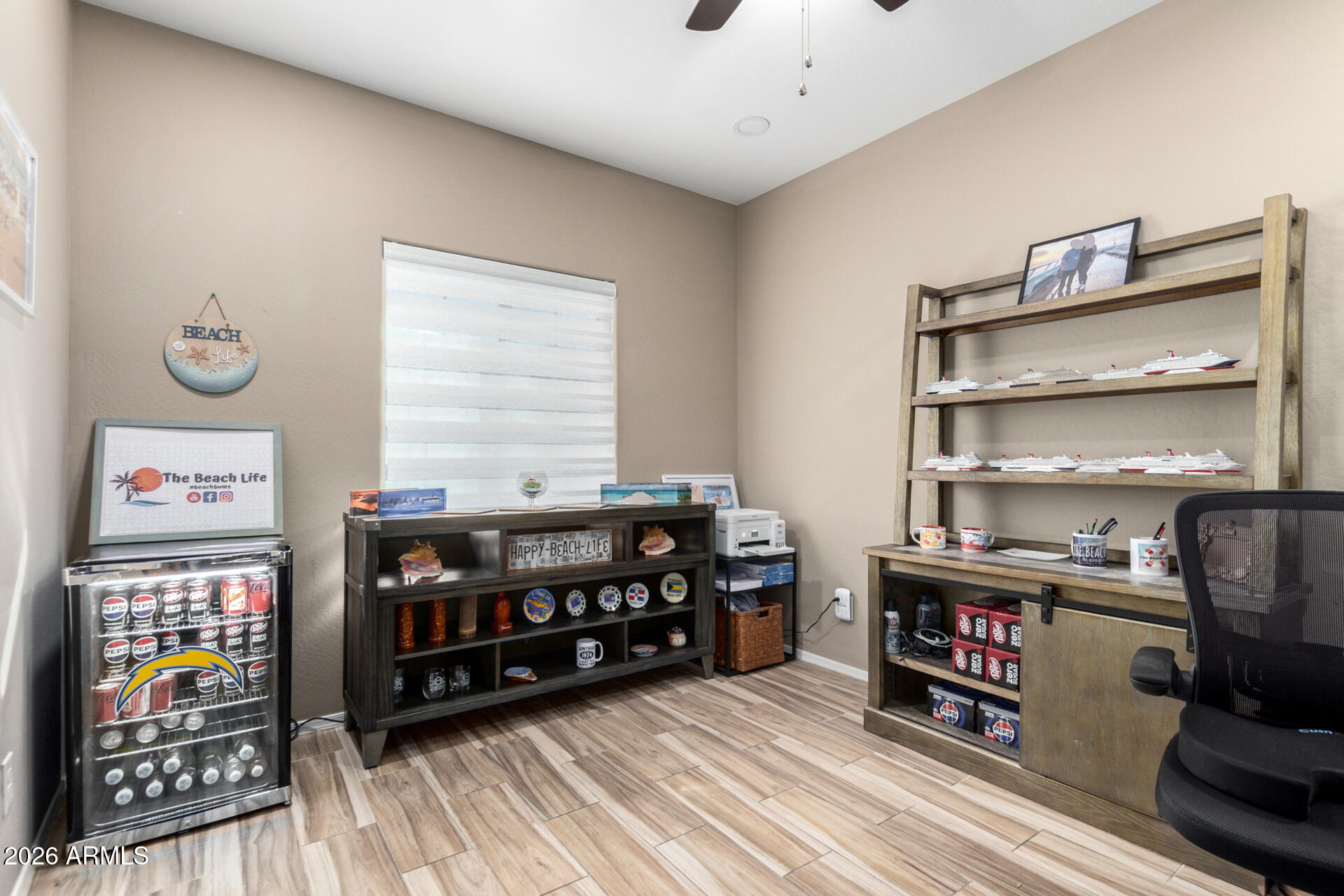 10816 West Nosean Road Peoria, AZ 85383 - Photo 37 of 42 a view of a workspace with furniture and wooden floor