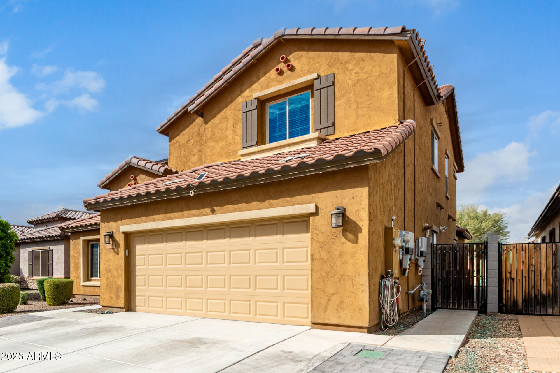 10816 West Nosean Road Peoria, AZ 85383 - Photo 5 of 42 a view of a house with a wooden door