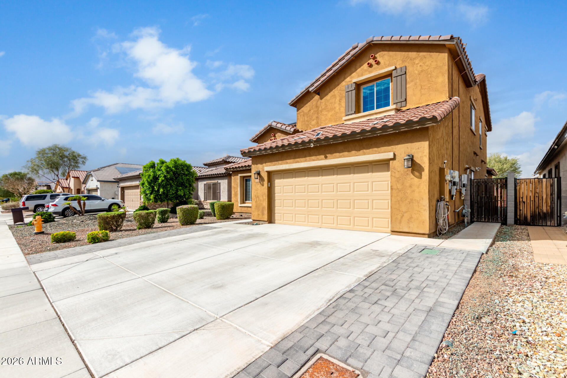 10816 West Nosean Road Peoria, AZ 85383 - Photo 6 of 42 a front view of a house with a yard and garage
