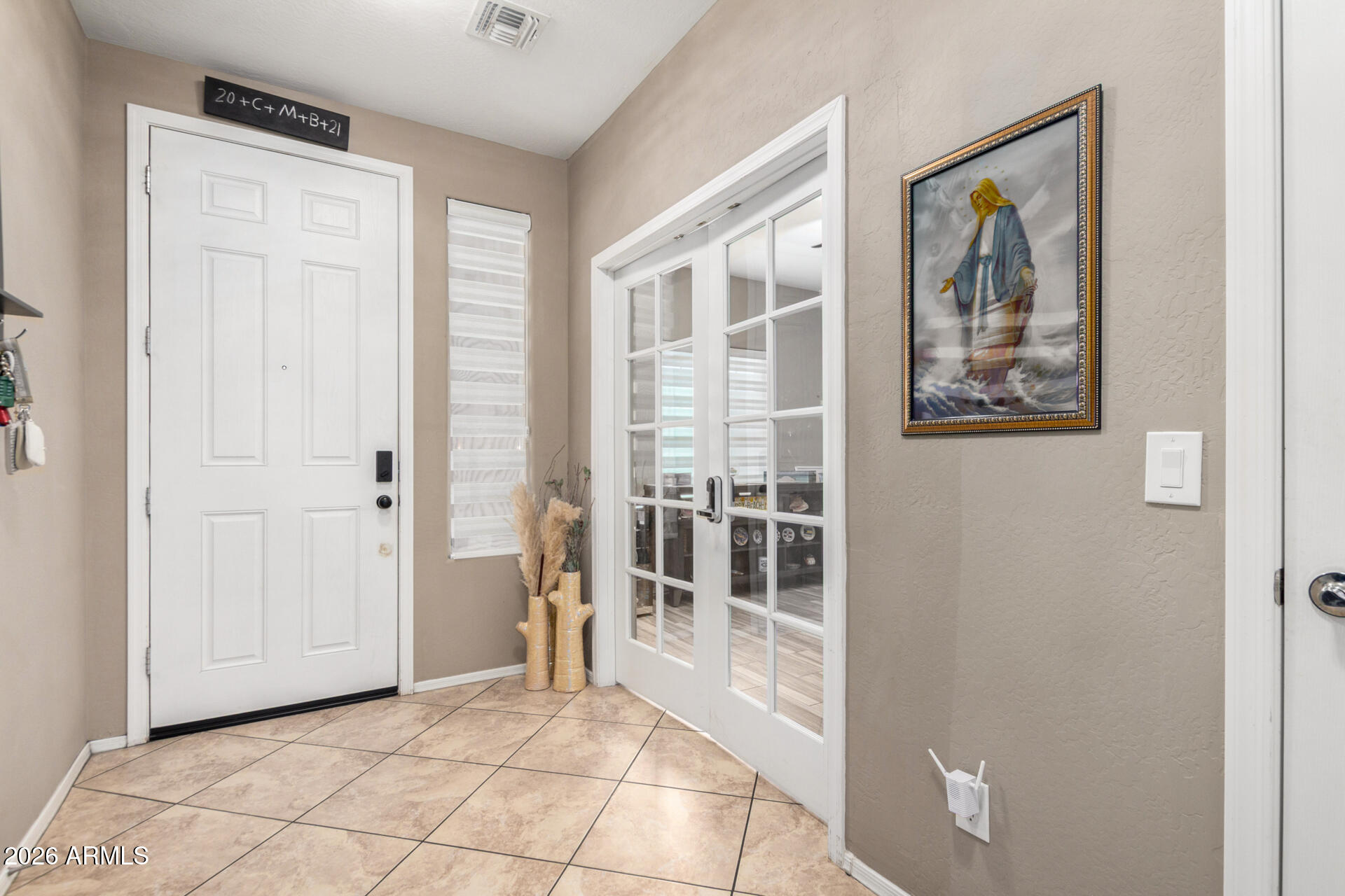 10816 West Nosean Road Peoria, AZ 85383 - Photo 7 of 42 a view of room with window and hallway