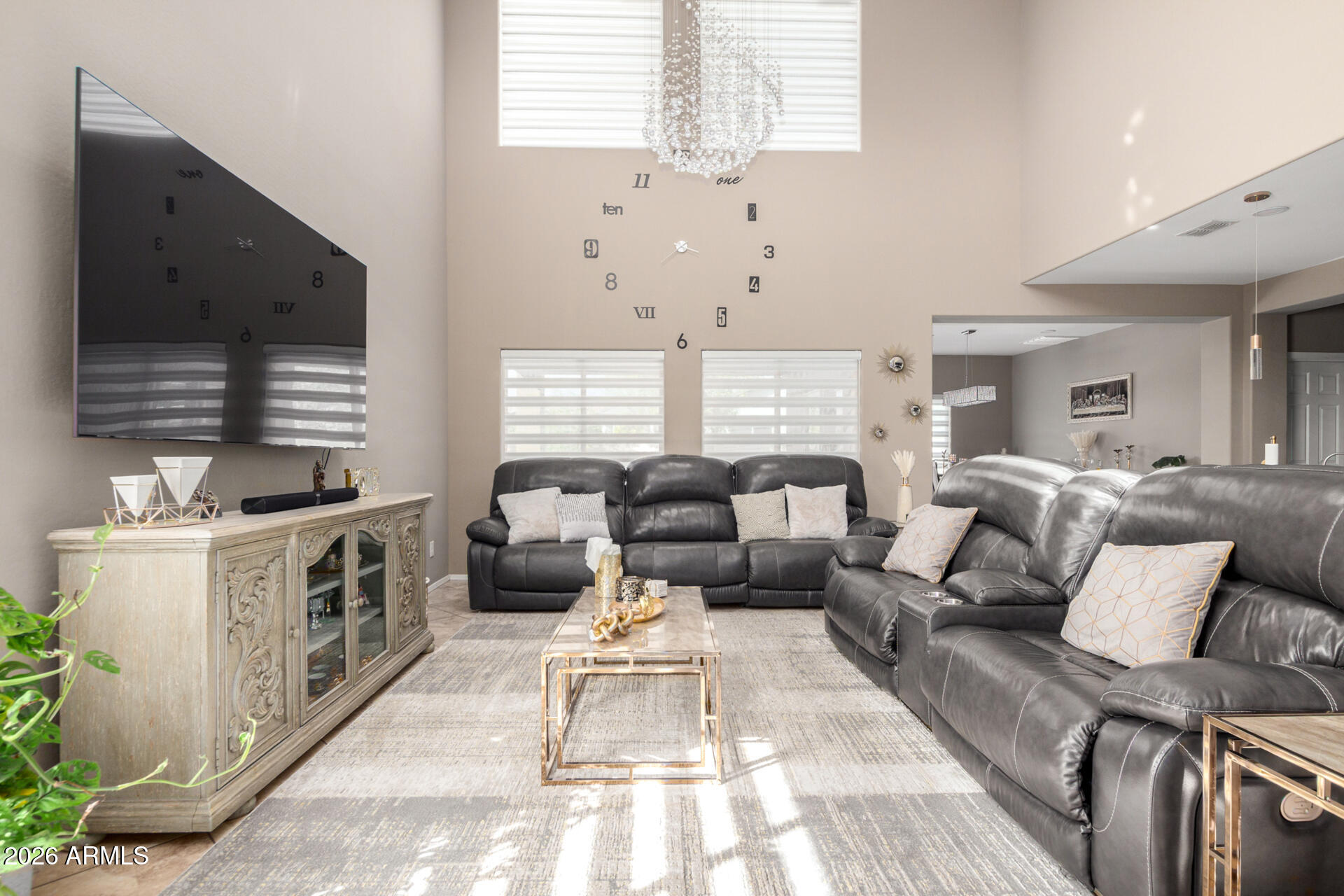 10816 West Nosean Road Peoria, AZ 85383 - Photo 9 of 42 a living room with furniture and a flat screen tv