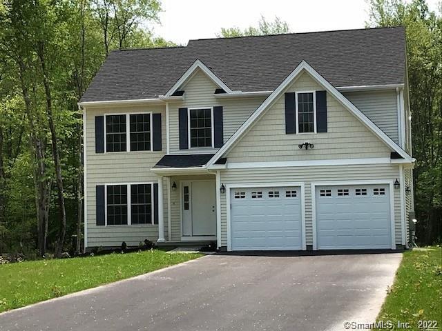 3 Coleman Road Middletown, CT 06457 - Photo 5 of 6 a front view of a house with a garden and garage