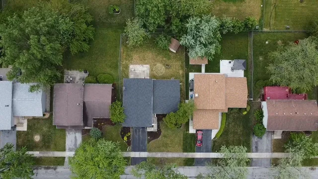 an aerial view of house with yard