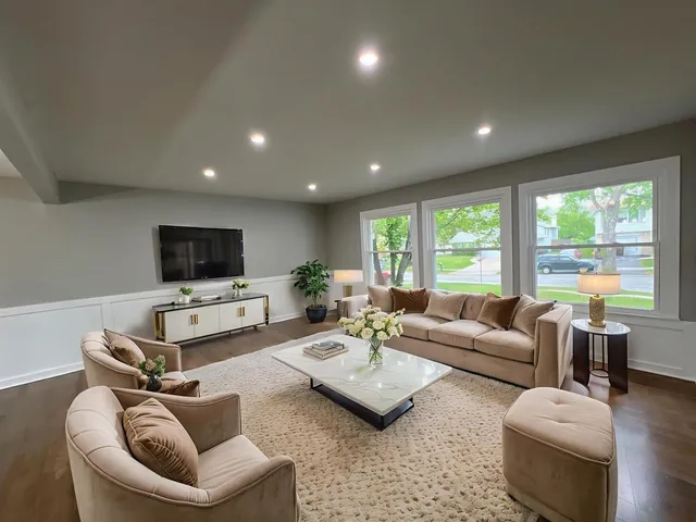 a living room with furniture and a flat screen tv