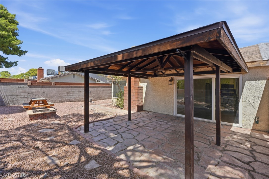 3971 Spring Leaf Drive Las Vegas, NV 89147 - Photo 23 of 48 An inviting covered patio and fire pit create an ideal outdoor entertaining area.