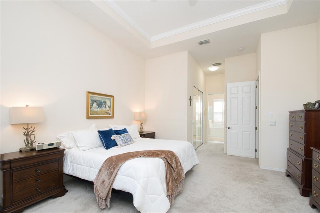 2808 Falcon Ridge Clermont, FL 34711 - Photo 17 of 65 a bed room with a bed and a tv