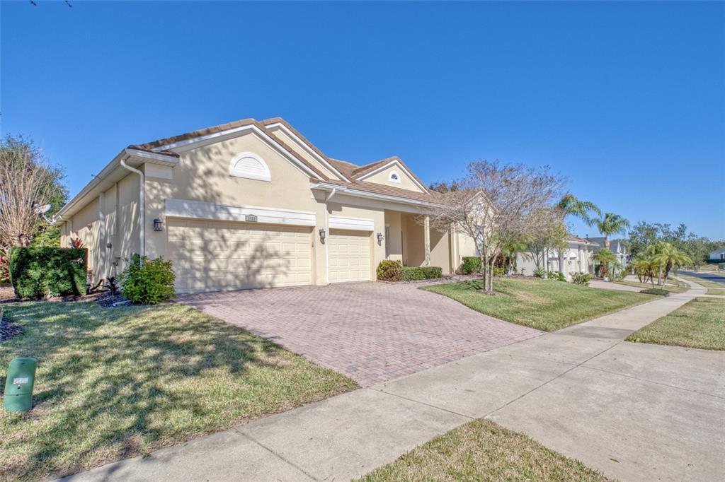 2808 Falcon Ridge Clermont, FL 34711 - Photo 20 of 65 a front view of a house with a yard and garage