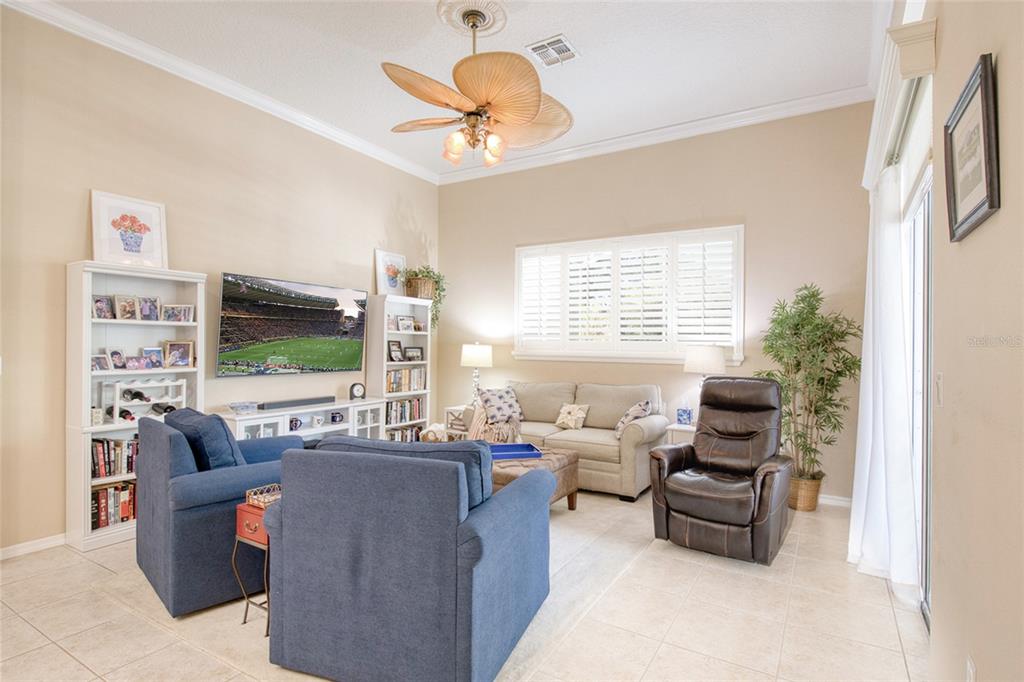 2808 Falcon Ridge Clermont, FL 34711 - Photo 25 of 65 a living room with furniture and a flat screen tv