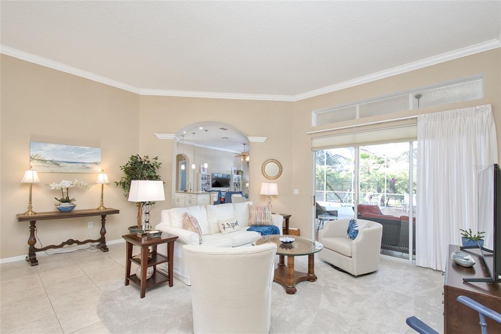 2808 Falcon Ridge Clermont, FL 34711 - Photo 26 of 65 a living room with furniture and a large window