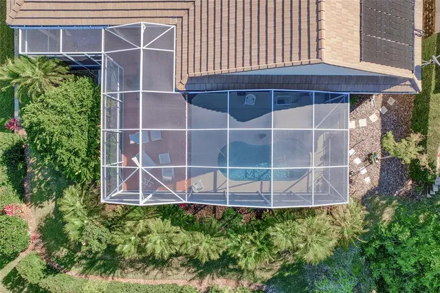 a living room with patio furniture and a table