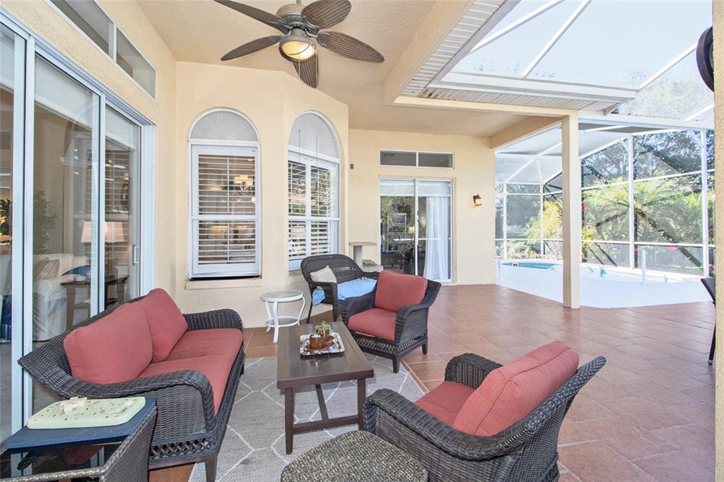 2808 Falcon Ridge Clermont, FL 34711 - Photo 37 of 65 a living room with furniture a table and a large window