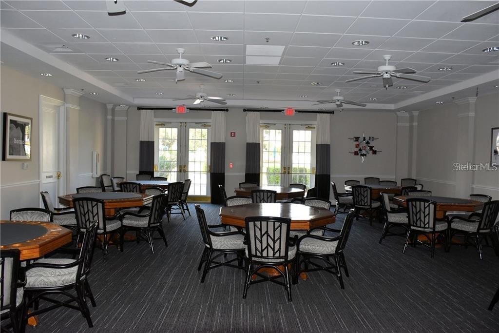 2808 Falcon Ridge Clermont, FL 34711 - Photo 48 of 65 a view of a dining room with furniture and wooden floor