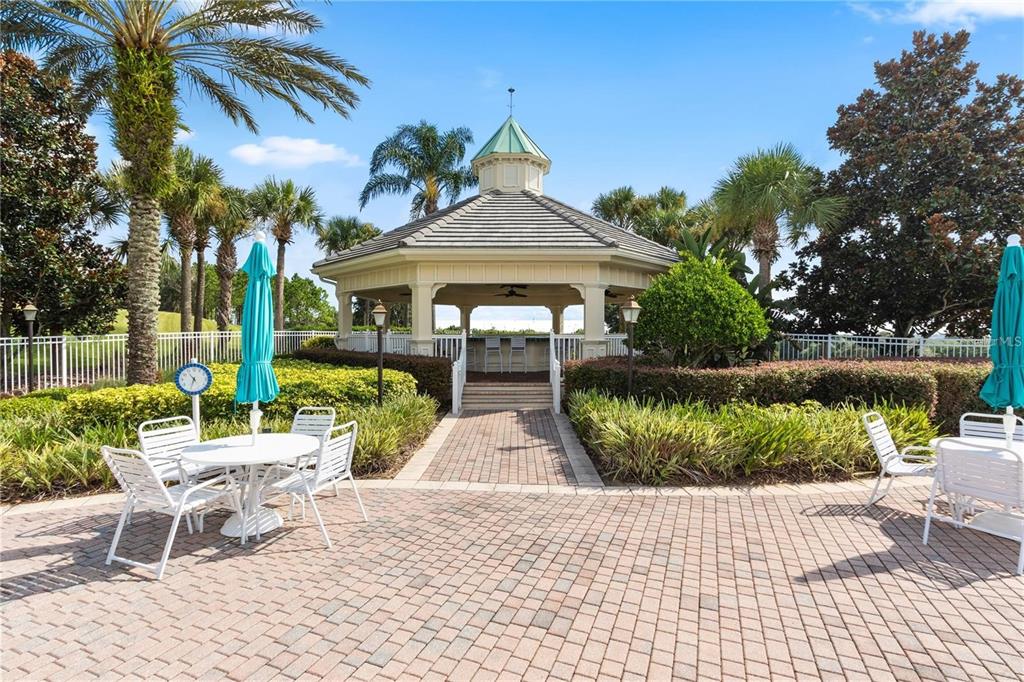 2808 Falcon Ridge Clermont, FL 34711 - Photo 61 of 65 a view of a chairs and table in backyard