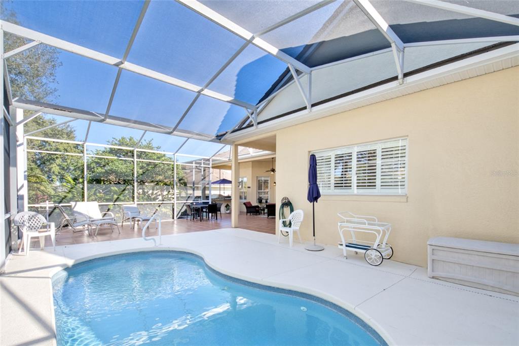 2808 Falcon Ridge Clermont, FL 34711 - Photo 7 of 65 a view of a patio with table and chairs and potted plants