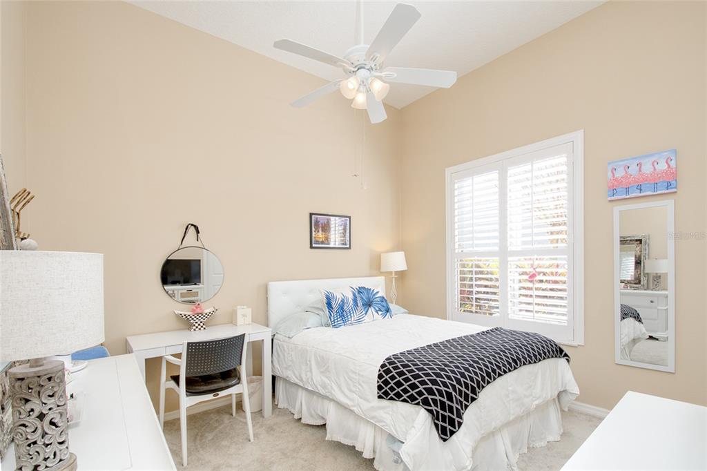 2808 Falcon Ridge Clermont, FL 34711 - Photo 9 of 65 a bedroom with a large bed and a window