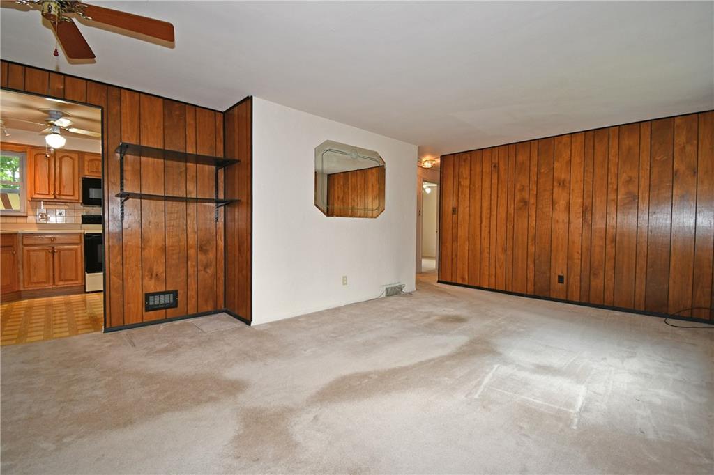 801 Highview Road Pittsburgh, PA 15234 - Photo 5 of 30 a view of an empty room with wooden floor and windows