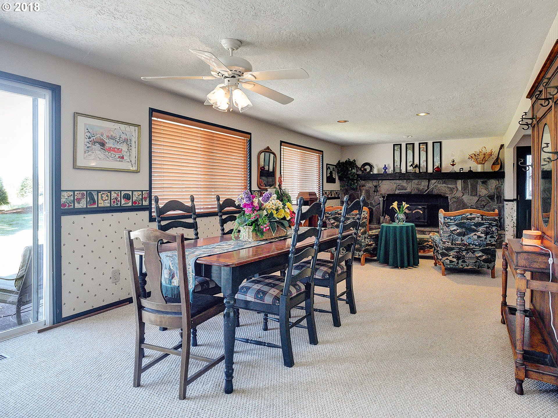 9850 South Barnards Road Canby, OR 97013 - Photo 11 of 32 a view of a dining room with furniture and a chandelier