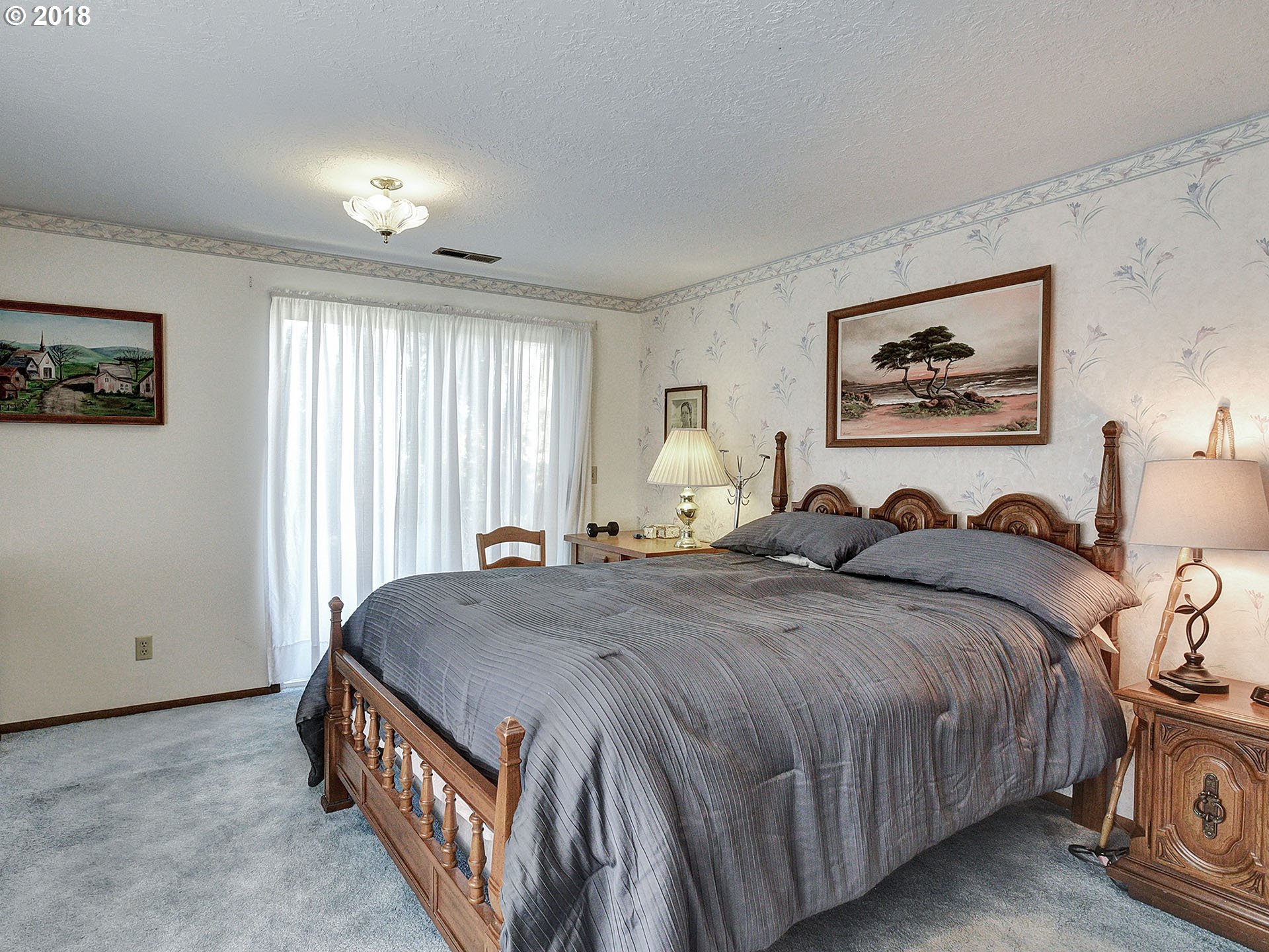9850 South Barnards Road Canby, OR 97013 - Photo 16 of 32 a spacious bedroom with a bed and a window