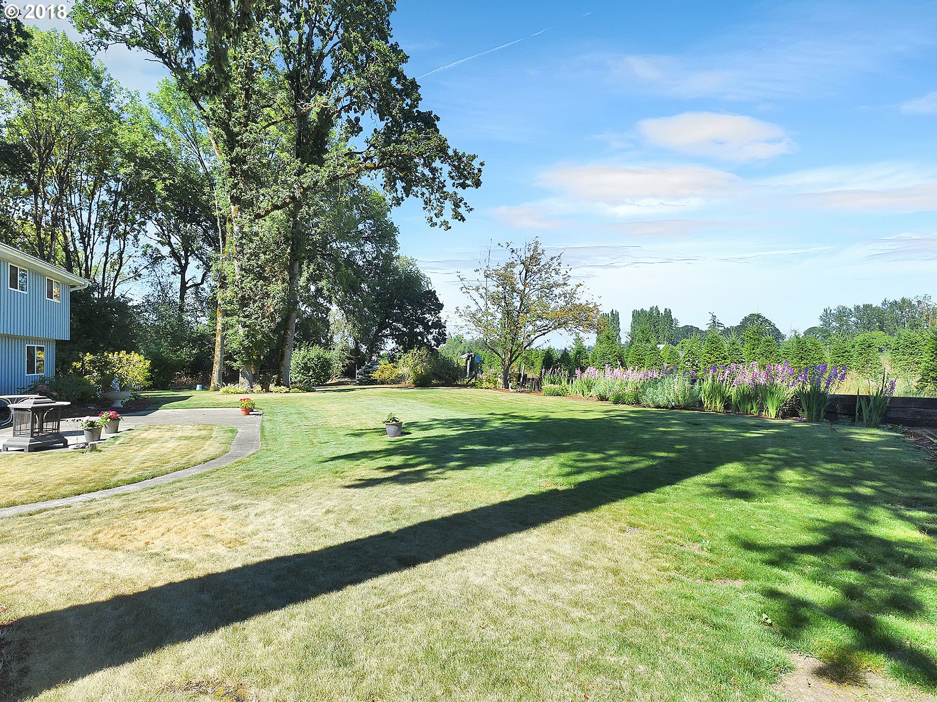 9850 South Barnards Road Canby, OR 97013 - Photo 27 of 32 a view of a park with large trees and a big yard