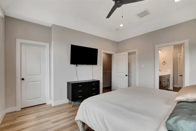 a bathroom with a granite countertop tub sink double vanity granite and shower