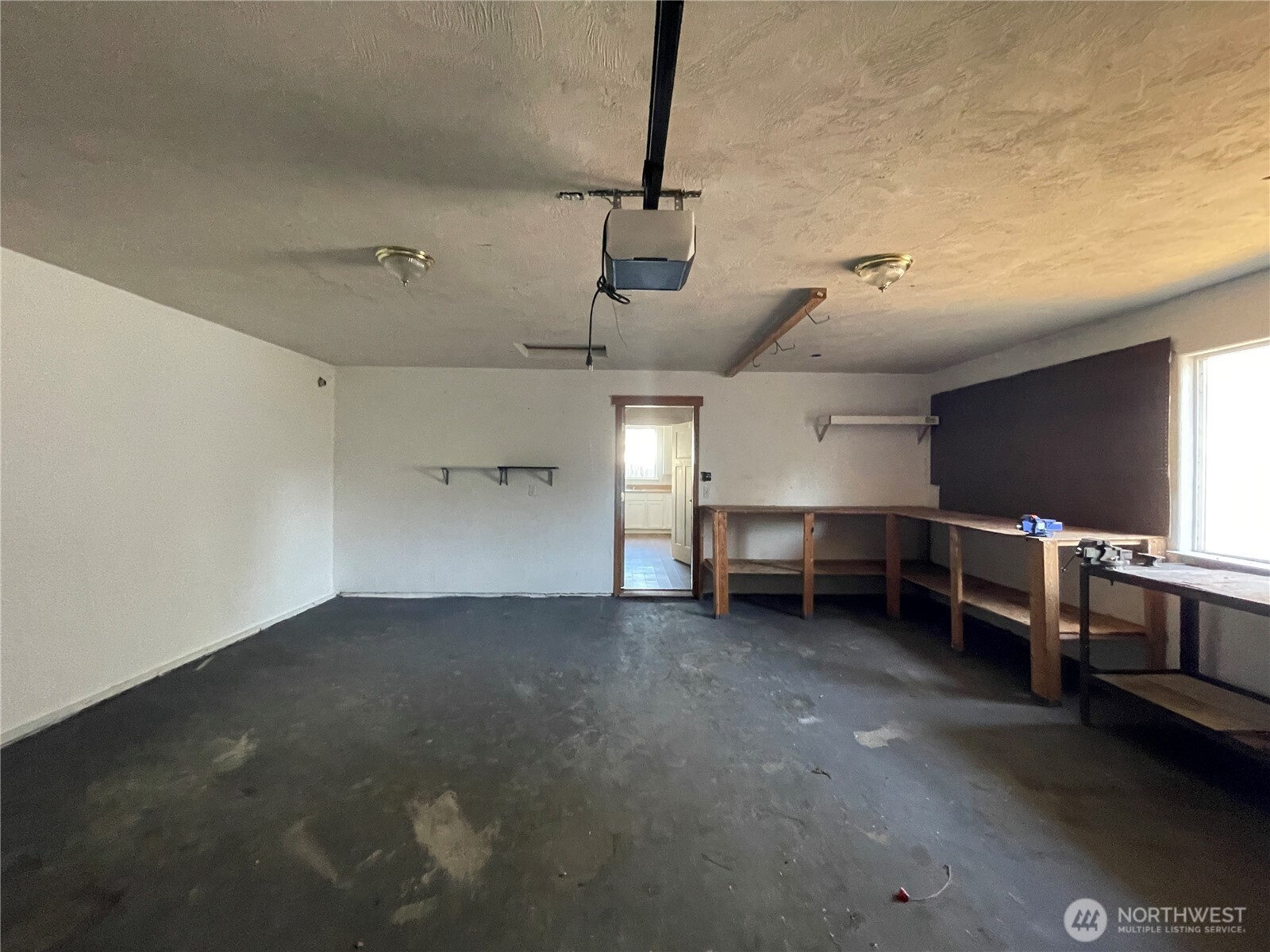 911 West Front Street Winlock, WA 98596 - Photo 14 of 30 a view of a livingroom with furniture and a kitchen