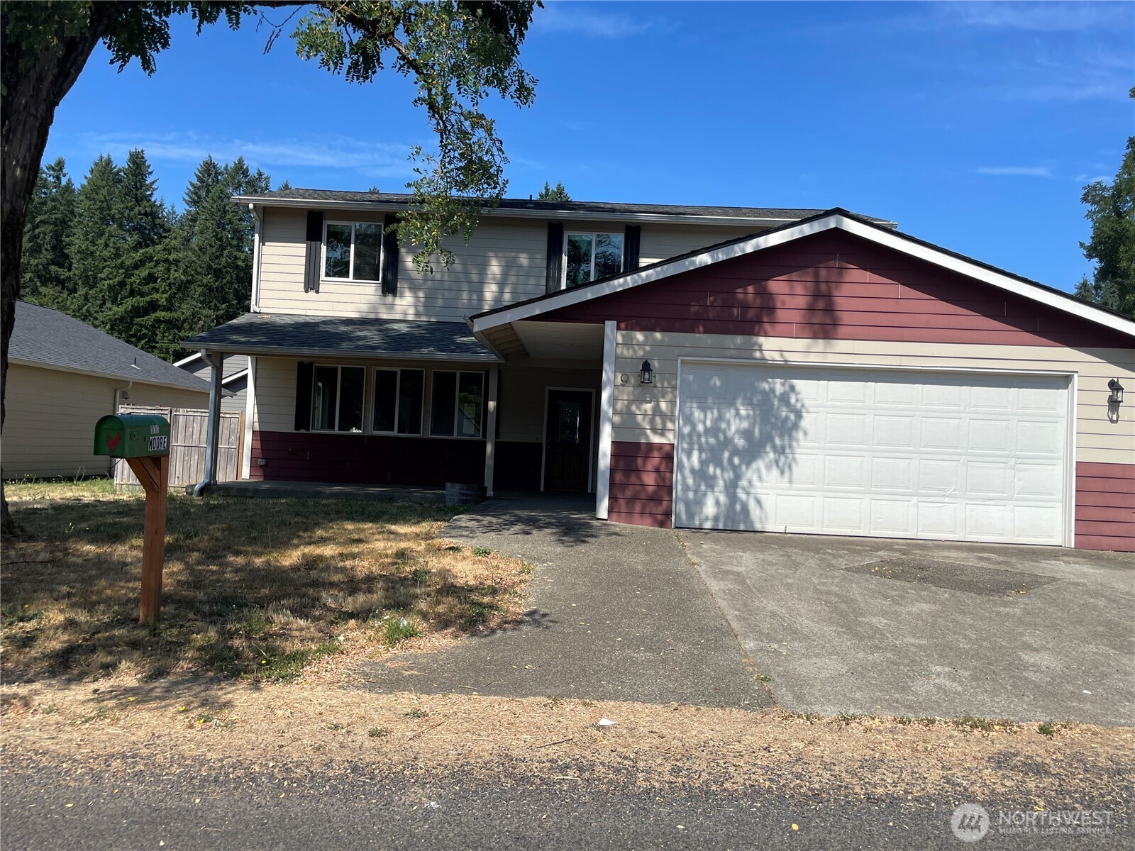 911 West Front Street Winlock, WA 98596 - Photo 2 of 30 a front view of a house with a yard and garage