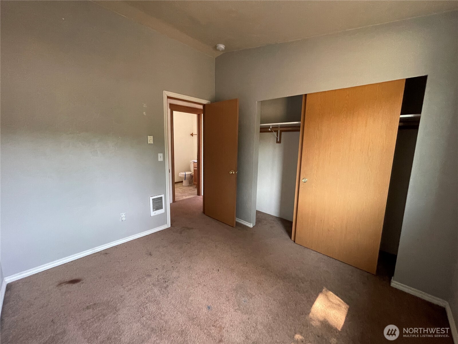 911 West Front Street Winlock, WA 98596 - Photo 25 of 30 an empty room with closet and wooden floor