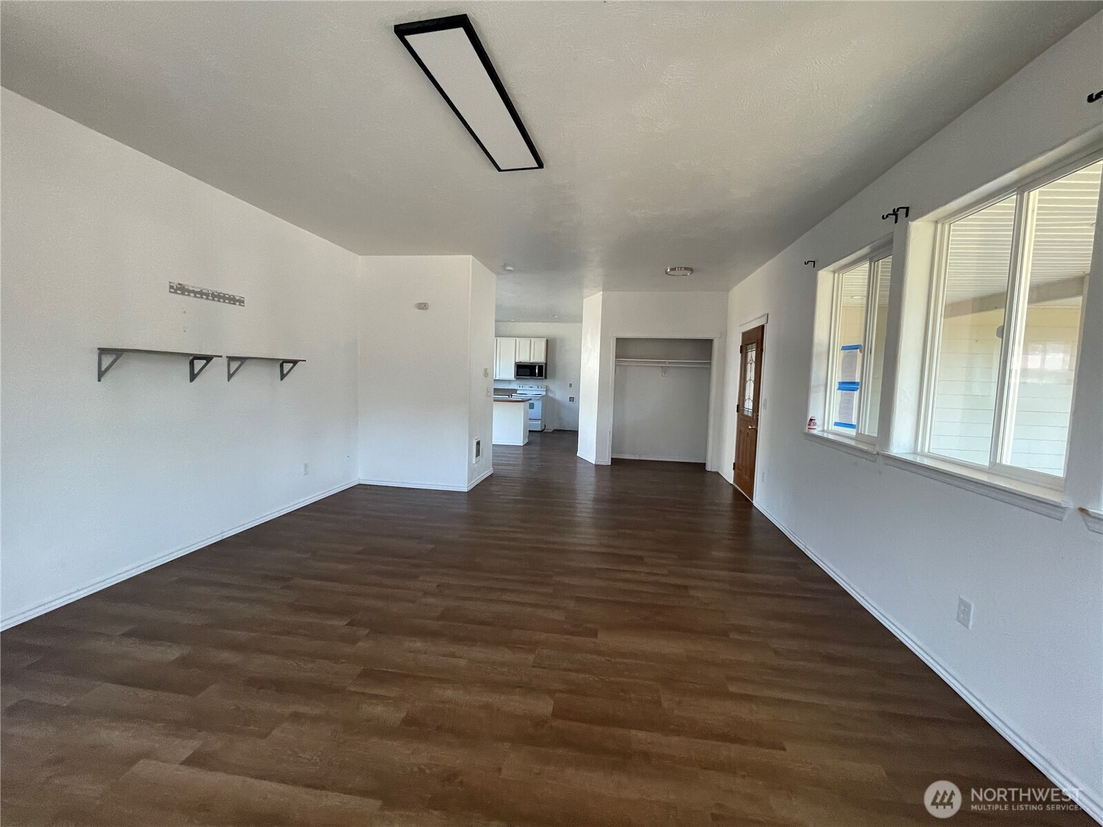 911 West Front Street Winlock, WA 98596 - Photo 5 of 30 a view of empty room with wooden floor and fan