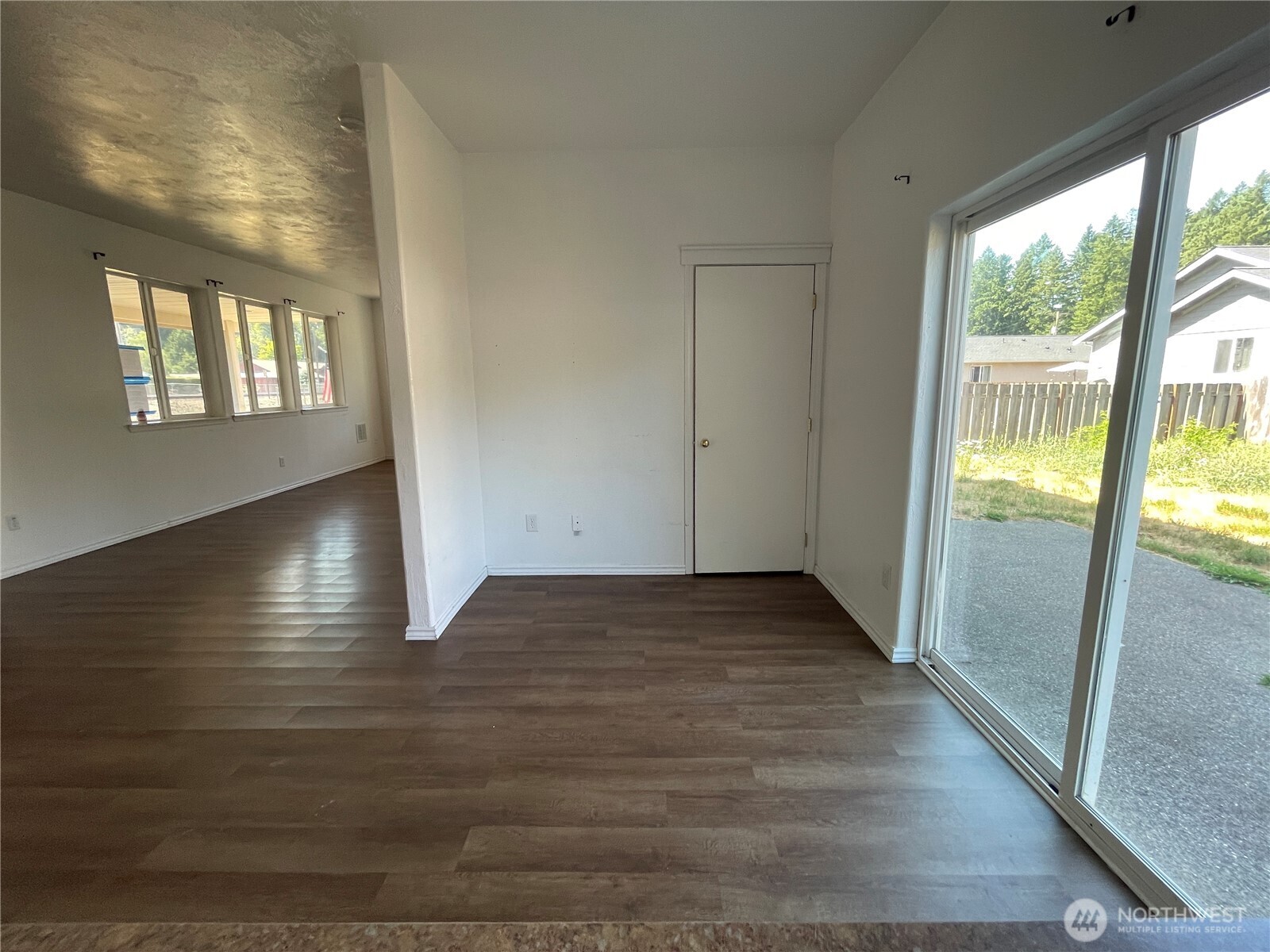911 West Front Street Winlock, WA 98596 - Photo 8 of 30 a view of empty room with wooden floor and fan