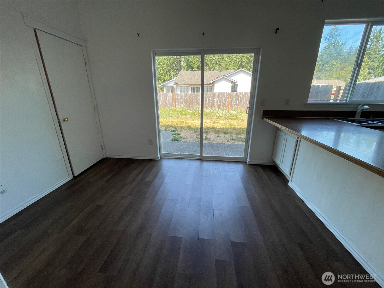911 West Front Street Winlock, WA 98596 - Photo 9 of 30 a view of an empty room with wooden floor and a window