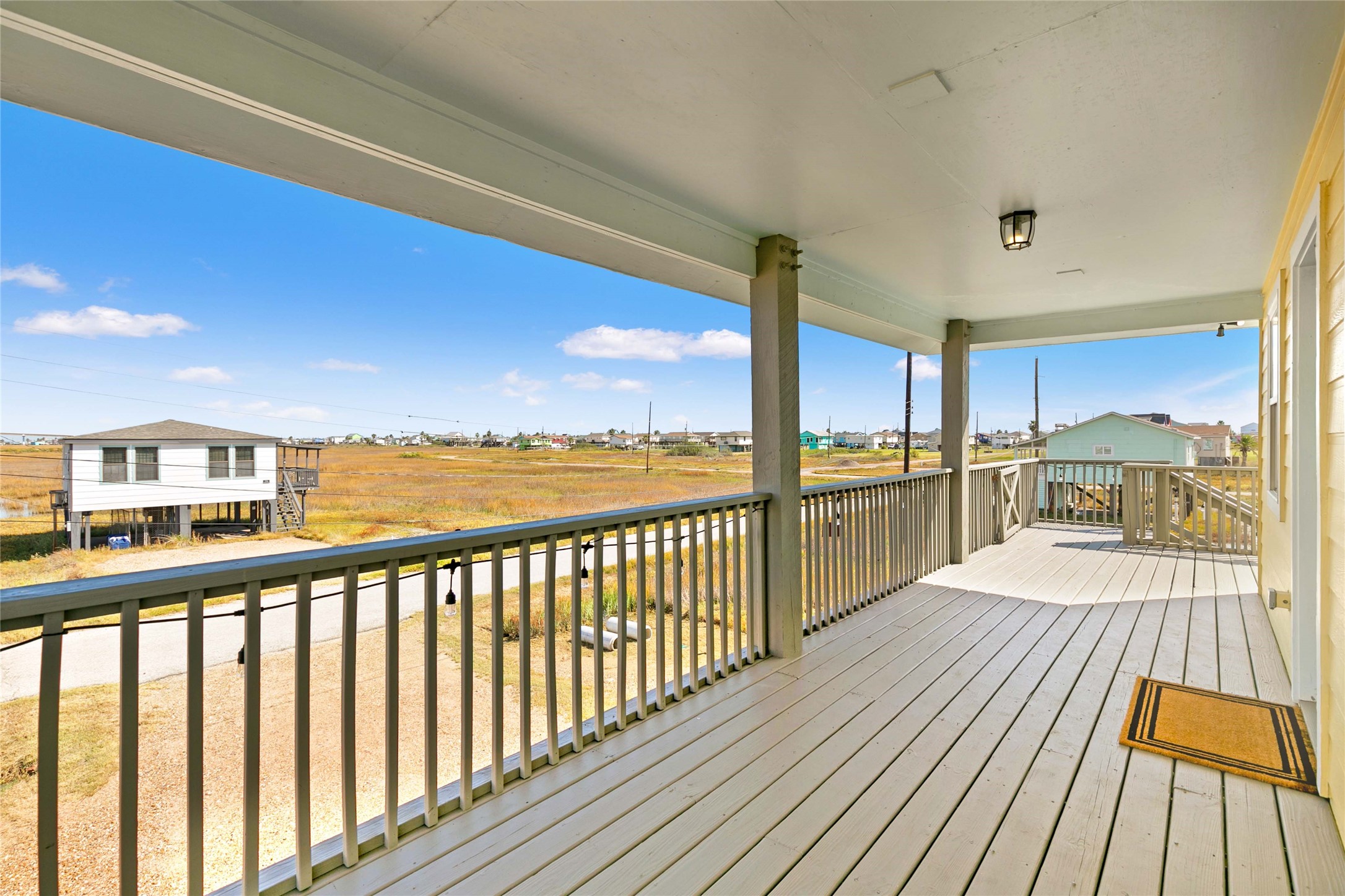 715 Caisson Street Surfside Beach, TX 77541 - Photo 23 of 35 Covered deck area is perfect for watching the morning sunrise over the water.