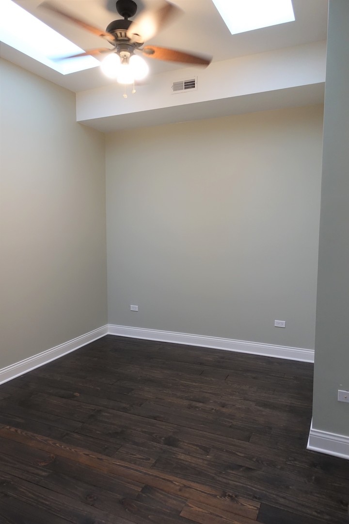 809 North Franklin Street, Unit 3F Chicago, IL 60610 - Photo 14 of 17 a view of an empty room with wooden floor