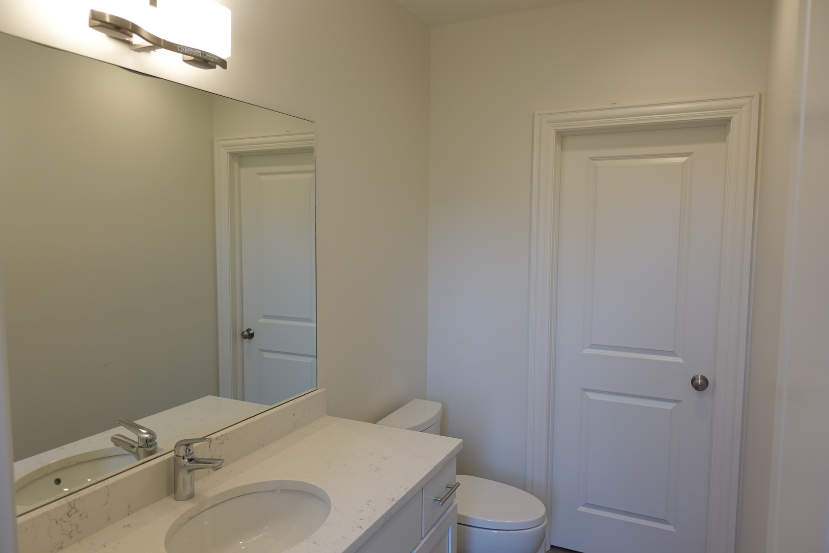 809 North Franklin Street, Unit 3F Chicago, IL 60610 - Photo 17 of 17 a bathroom with a sink toilet and vanity