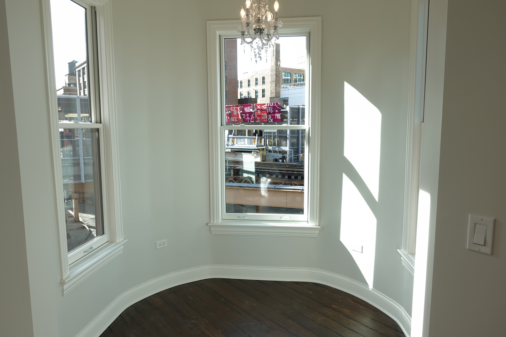 809 North Franklin Street, Unit 3F Chicago, IL 60610 - Photo 7 of 17 a view of a room with wooden floor and windows