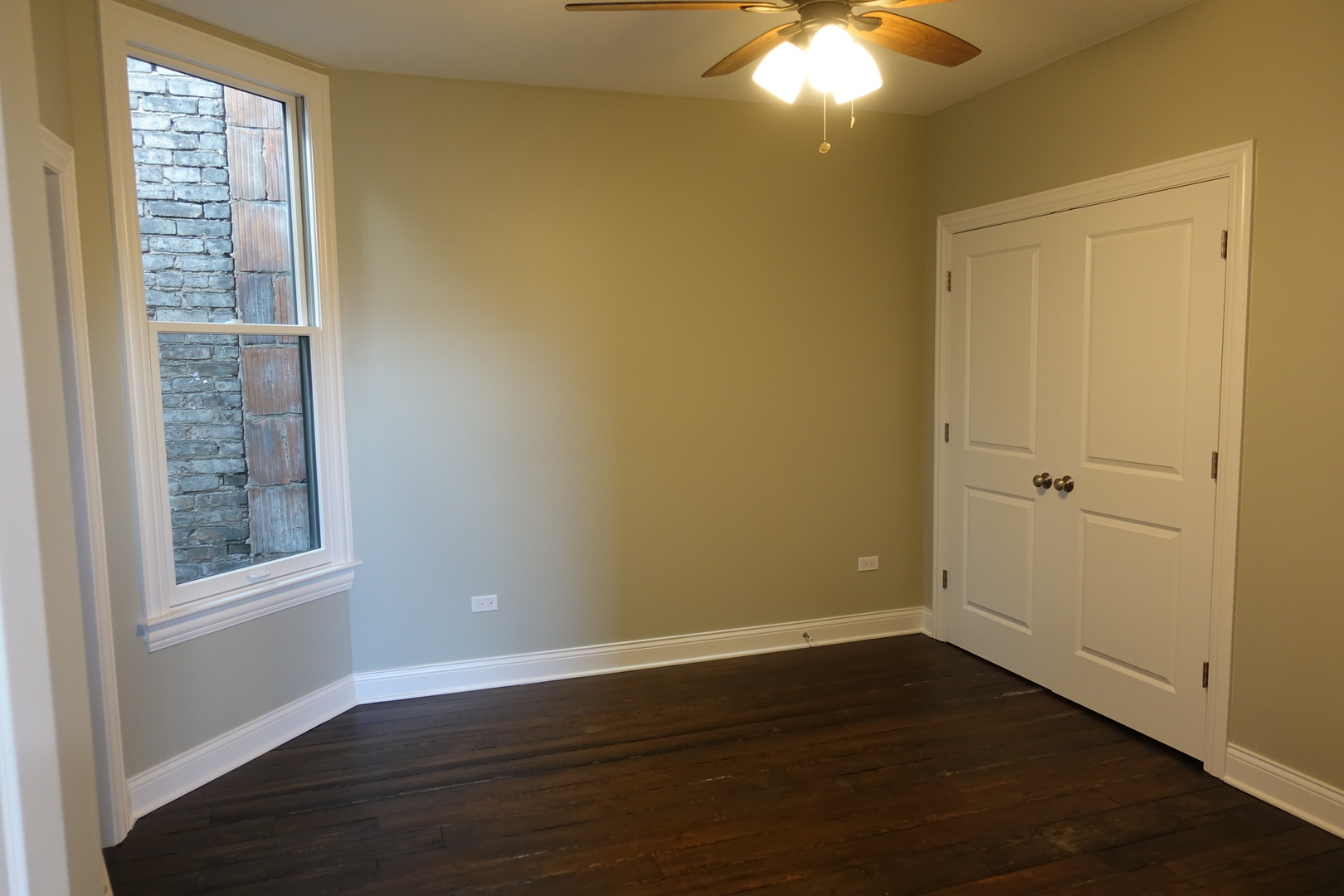 809 North Franklin Street, Unit 3F Chicago, IL 60610 - Photo 9 of 17 a view of an empty room with wooden floor and a window