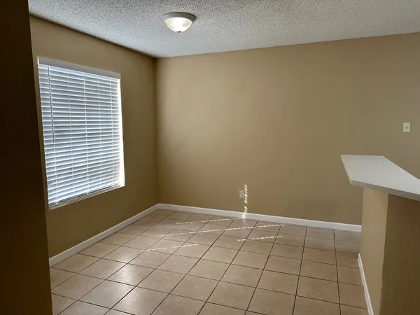 a view of an empty room with windows