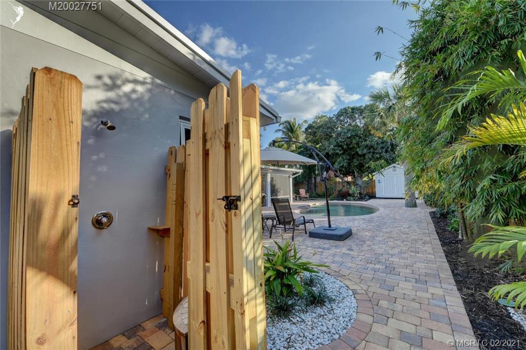 814 Southeast Riverside Drive Stuart, FL 34994 - Photo 29 of 48 Brick paver side patio with outside shower