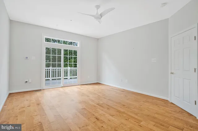 a bathroom with a granite countertop sink and a bathtub
