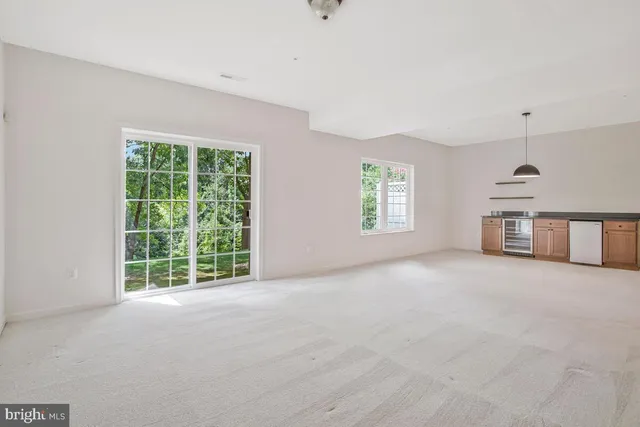a view of a swimming pool with an outdoor seating and a yard