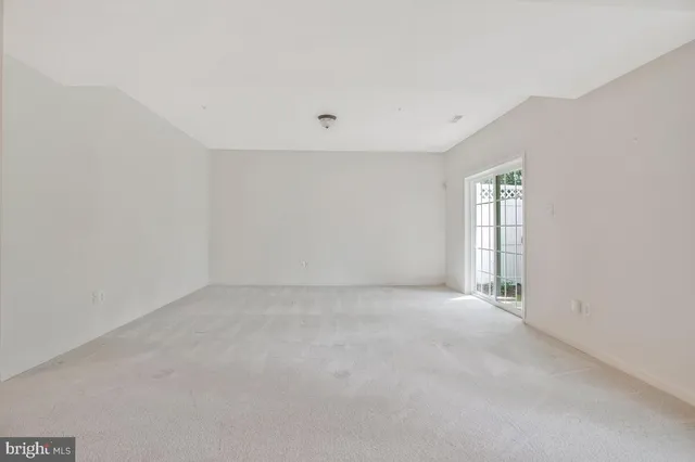 a view of a swimming pool with a table and chairs