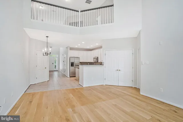 a kitchen with a stove a sink and a refrigerator