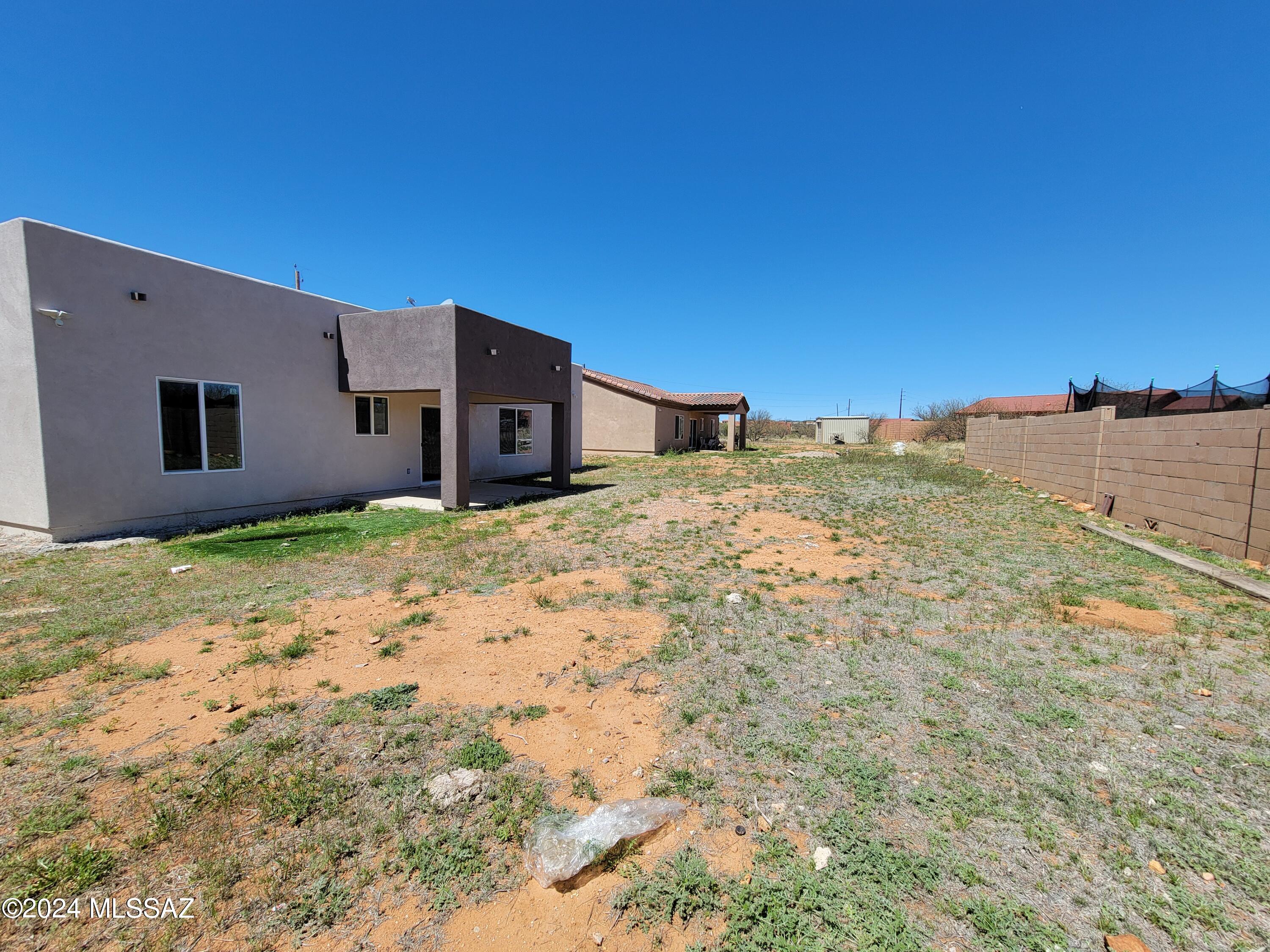1763 Aguila Court Rio Rico, AZ 85648 - Photo 32 of 34 a house view with a backyard