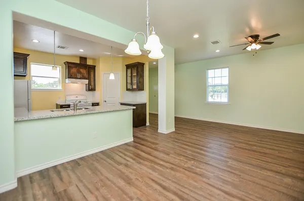 a view of a kitchen from the kitchen and windows