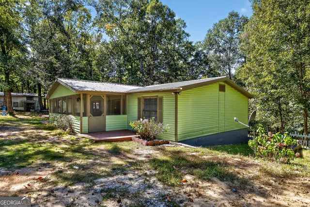 a front view of a house with yard