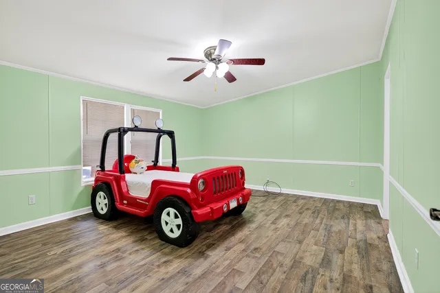 a view of a room with air conditioner duct and wooden floor